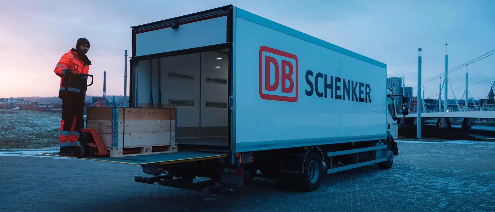 DB Schenker delivery truck with worker loading cargo